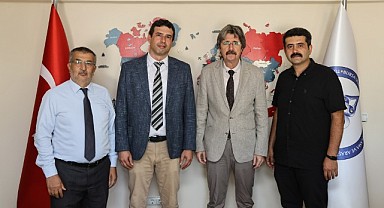 TÜDAM'da bayrak değişimi